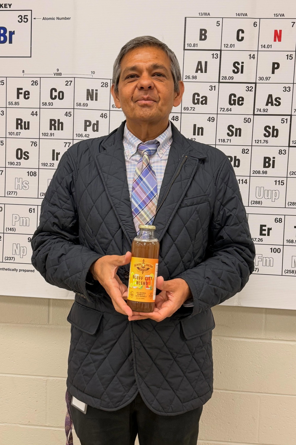 Rajiv Rohatgi, founder, with a Brewer's Junction bottle